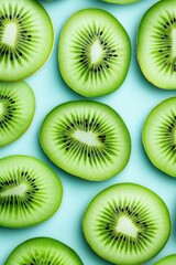 Fototapeta premium Fresh kiwi slices arranged against a surreal turquoise backdrop creating a modern artistic visual experience