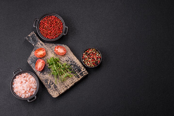 Sprigs of green fresh microgreen peas on wooden cutting board