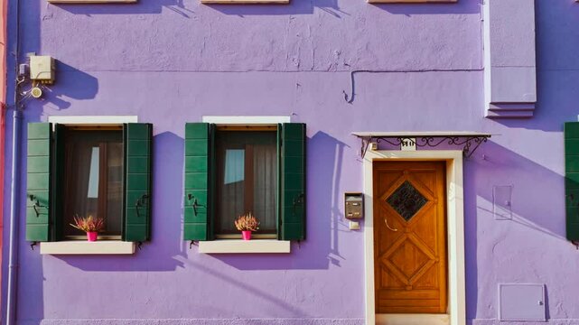 Revealing a colorful building in the island of Burano, Venice, Italy. Venice is an archipelago of 126 islands linked by 472 bridges