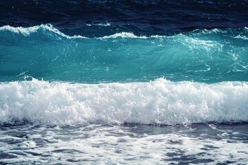 Fototapeta premium Ocean Waves Gradient: Waves crashing onto the shore with colors transitioning from deep navy blue to turquoise and white foam