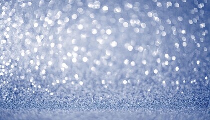 Fototapeta premium shimmering silver and blue bokeh background with sparkling light reflections, perfect for elegant festive or winter designs