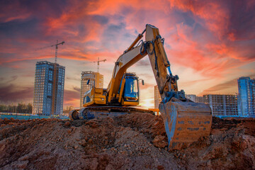 Excavator on groundwork on Construction site. Backhoe dig foundation for house construction....