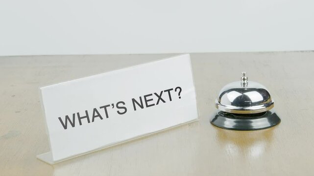 What's Next Office or Room with Hand Ringing The Bell on Desk or Table Multiple Times