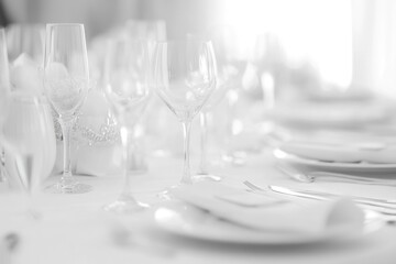 Close-up of a table set with wine glasses, ideal for use in food and drink related content