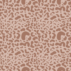 Seamless pattern with leopard spots, brown shapes on a soft pink backdrop. Aesthetic background for apparel, room decor, tee prints, fabric, wrapping, design projects highlighting natural themes