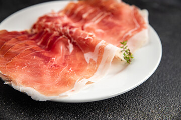 Jamon meat iberico or serrano snack aperitif fresh tasty food dish gourmet food background on the table rustic food top view copy space