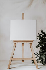 Blank canvas on wooden easel.
