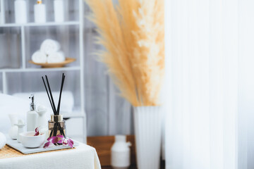 Exquisite display of beauty treatment and spa salon accessories arranged on spa table in luxury spa resort. Relaxing spa massage and recreation background concept. Quiescent