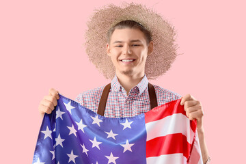 Male farmer with USA flag on pink background