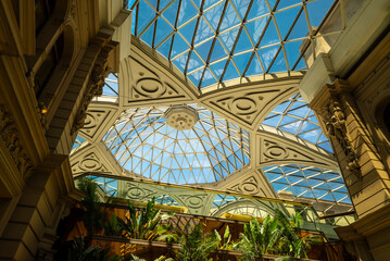 A large building with a dome on top and a glass ceiling