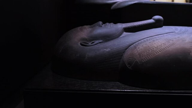 A detailed view of the Tabnit Sarcophagus on display at the Istanbul Archaeological Museums. The head of the human figure on the lid of the sarcophagus is remarkable for its detailed workmanship.