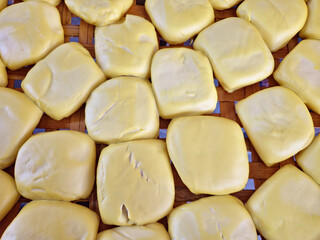 Yellow firm tofu blocks. Top view image 