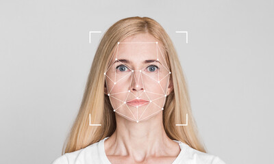 A woman with long blonde hair stares directly at the camera, demonstrating facial recognition...