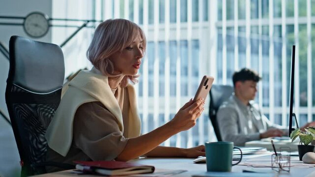 Stressed woman reacting business fail at office closeup. Lady throwing cellphone