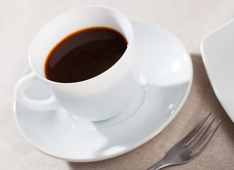 Image of cup of fresh black coffee americano on table, no people