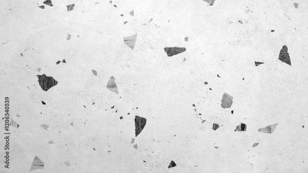 Poster a white background with black and grey pieces scattered all over it. the image has a rough and gritt