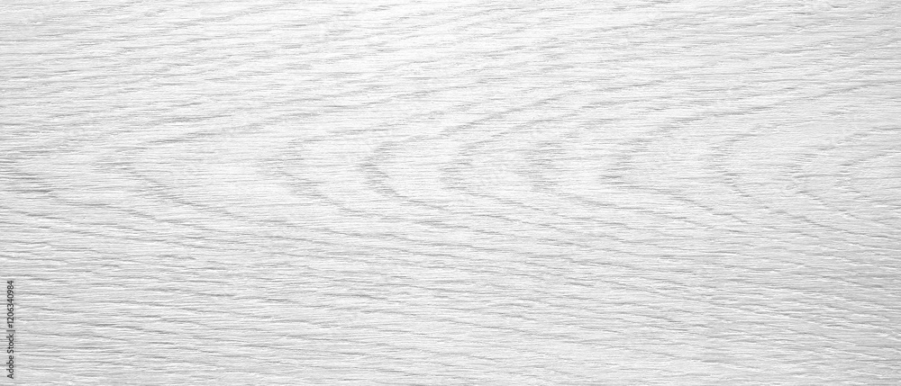 Aufkleber a white wooden surface with a grainy texture. the surface is smooth and has a natural look