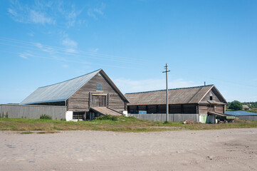 Country landscape, two large barns on Bolshoy Solovetsky Island, Russia