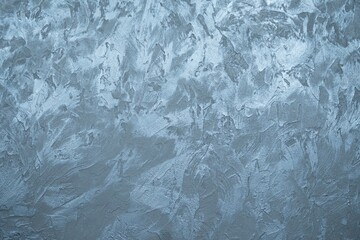 The texture of a concrete wall with anthracite and blue decorative plaster. Abstract background with place for text