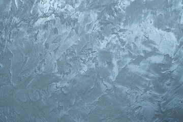 The texture of a concrete wall with anthracite and blue decorative plaster. Abstract background with place for text