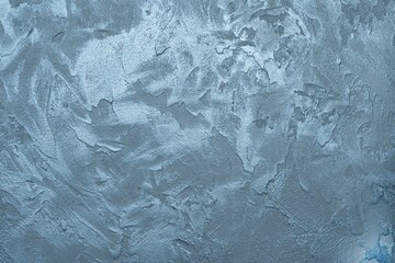Obraz premium The texture of a concrete wall with anthracite and blue decorative plaster. Abstract background with place for text