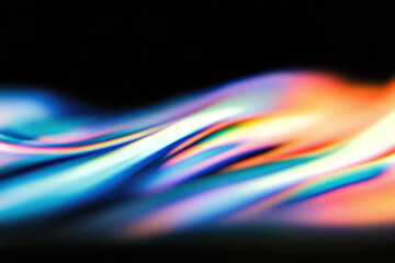 Colorful light trails flowing smoothly in the dark