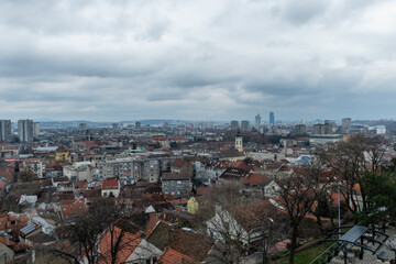 Scenic panoramic aerial view of Belgrade under heavily overcast sky in winter, Serbia