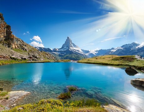 the blue lake and the matterhorn in a scenic summer landscape with sunny lights seen from breuil cervinia aosta valley italy