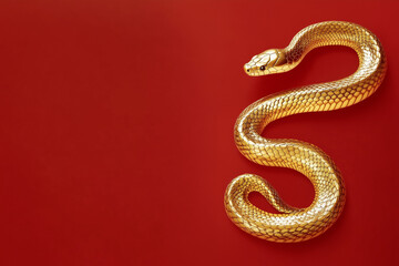 Obraz premium 3D gold snake on red background