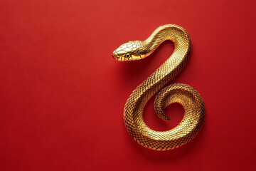 Fototapeta premium 3D gold snake on red background celebrating Chinese New Year
