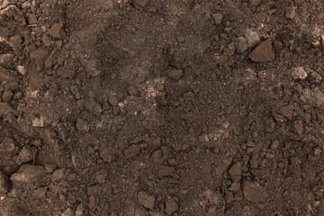 Brown dark soil ground abstract texture background with copyspace top view