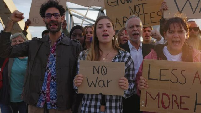 Activists protesting against war, holding signs and chanting slogans for peace and disarmament