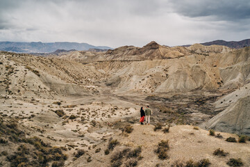 Tourists admiring the bardenas reales desert landscape in spain