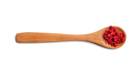 A spoon with freeze dried raspberries