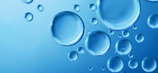 Blue drops and bubbles of clear water, blue abstract water background