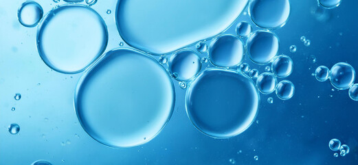 Blue drops and bubbles of clear water, blue abstract water background