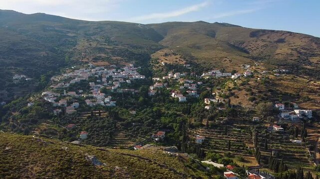 Aerial Orbit of Stenies Slope Village in Andros, Greece