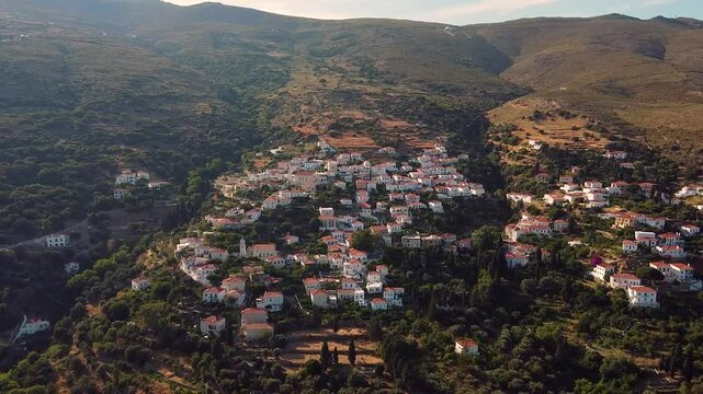 Aerial of Picturesque Stenies Slope Village in Andros at Sunset, Greece