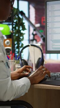 Vertical video Coder at workstation programming on PC, writing lines of code, using development tools, feeling stressed. Woman in home office having deadline, stressed to finish debugging software