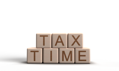 Tax time text font black cube block wooden white background dicut object us tax time day business financial taxation refund april month 2025 year government deadline budget money economy tax form bank