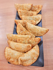 Fried pastry in dark plate