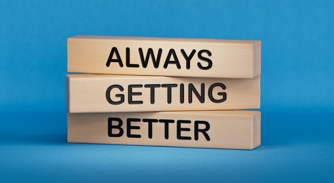 Always getting better symbol. Wooden blocks with words Always getting better.Business and Always getting better concept.Copy space.3D rendering on blue background.