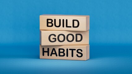 Build good habits symbol. Wooden blocks with words Build good habits.Business and Build good habits concept. Copy space.3D rendering on blue background.