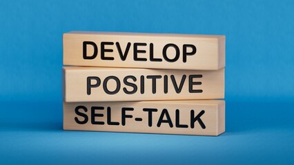 Develop positive self-talk symbol. Concept words Develop positive self-talk on wooden blocks.Business and Develop positive self-talk concept.3D rendering on blue background.