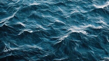 Fototapeta premium Deep blue ocean waves texture, perfect for backgrounds. Use for travel, nature, or ocean-themed designs.