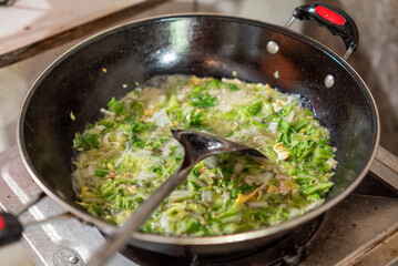 Stir-fried vegetables being cooked