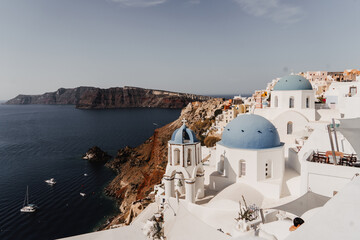 Fototapeta premium Overlooking the Blue Domed Church in Santorini