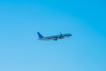 White passenger airplane flying in the sky amazing clouds in the background - Travel by air transport at japan, Travel.