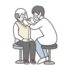 歯科検診を受ける高齢男性