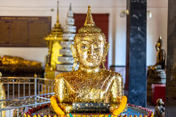 Fototapeta premium Background of Buddha statue, Wat Phra Thong, Wat Phra Phut, Phuket, Unseen, ancient temple, sacred, there are always Thai and foreign tourists visiting to make merit.